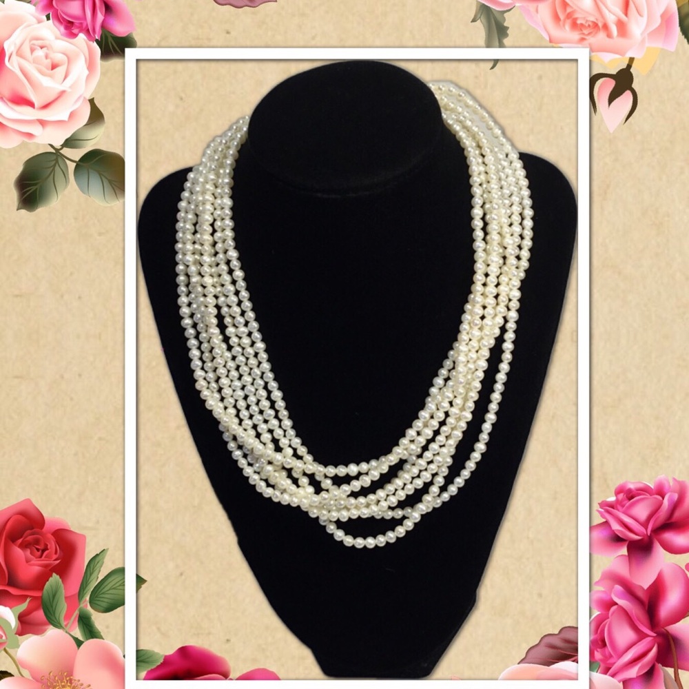 7 Strand Twisted Pearl Necklace 14 KT gold Clasp